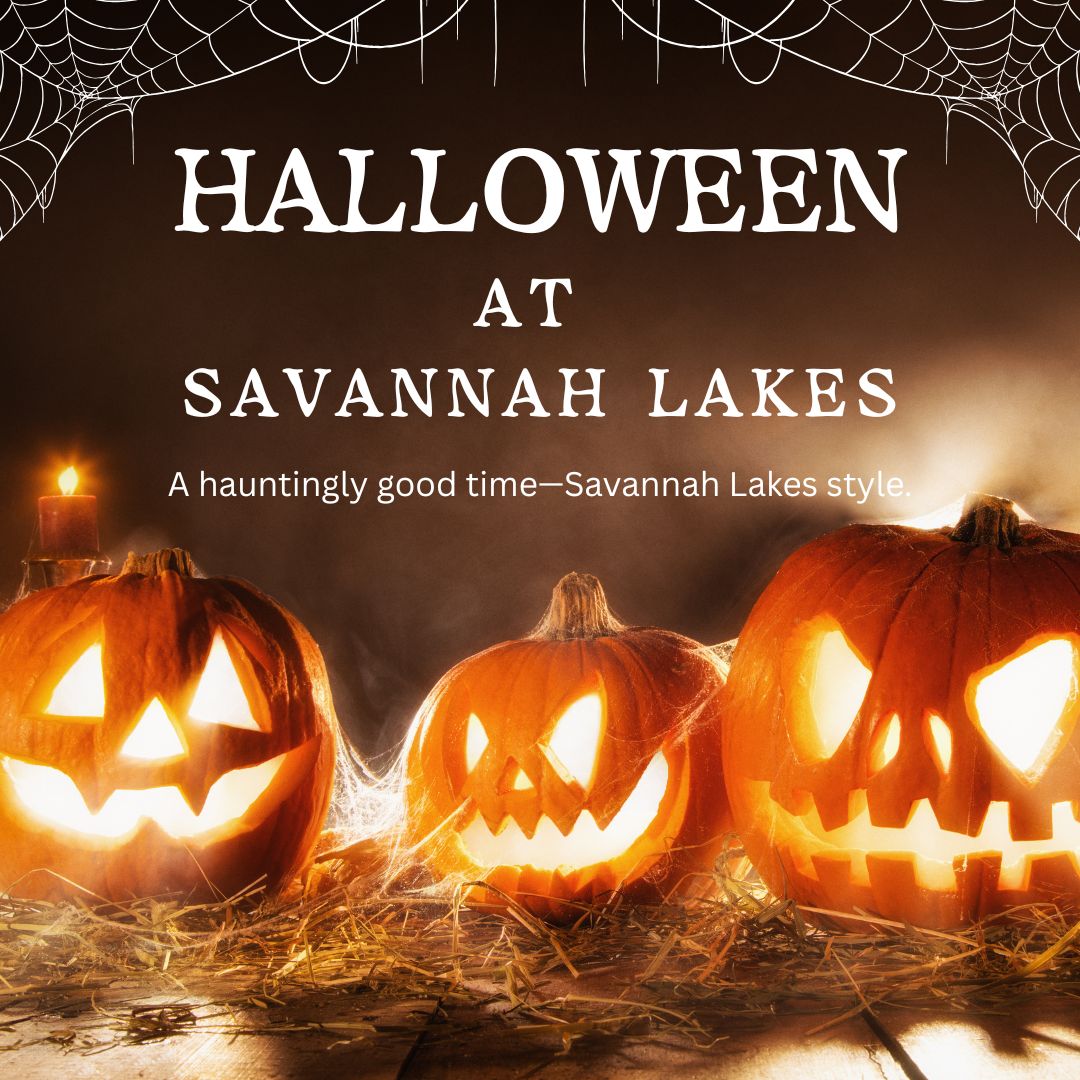 Three carved jack-o'-lanterns glow on a wooden surface with candles and cobwebs. Text reads: "Halloween at Savannah Lakes. A hauntingly good time—Savannah Lakes style.