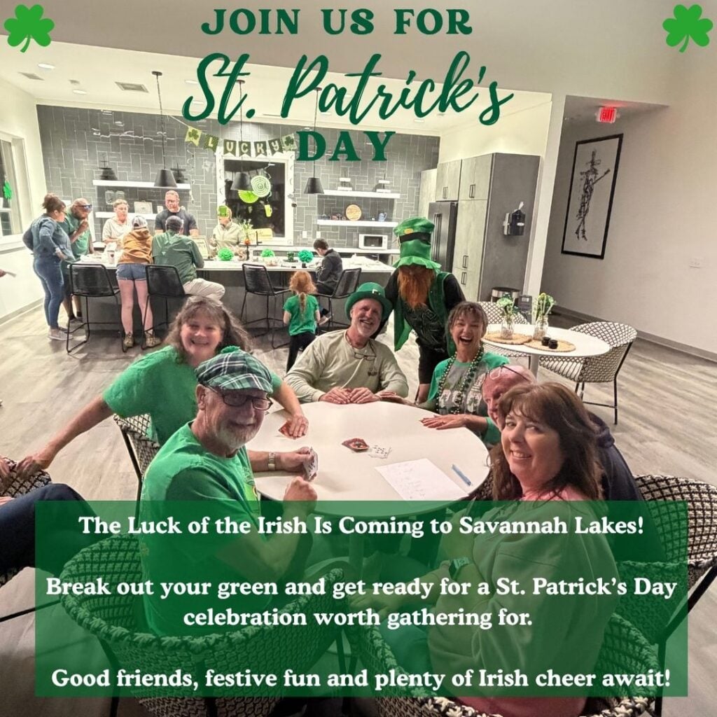 A group of people in green attire celebrates St. Patrick’s Day with food and drinks in a decorated kitchen and dining area.